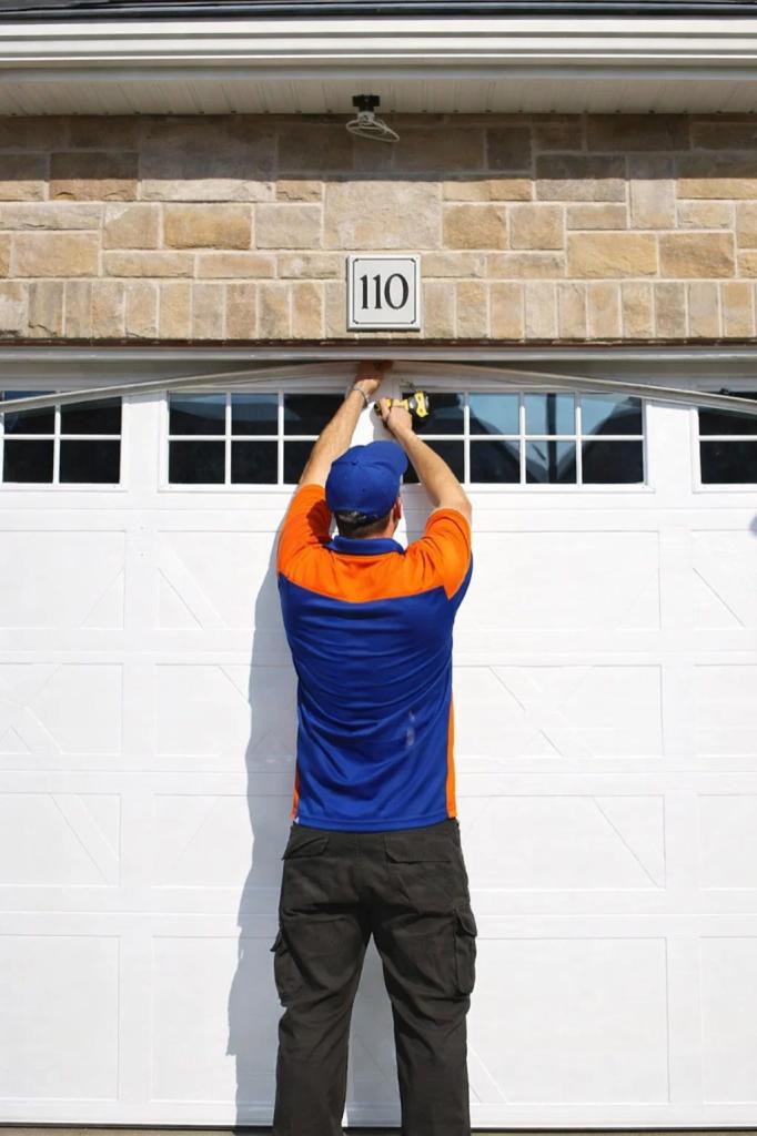 A technician in Timnath, CO replacing an old garage door