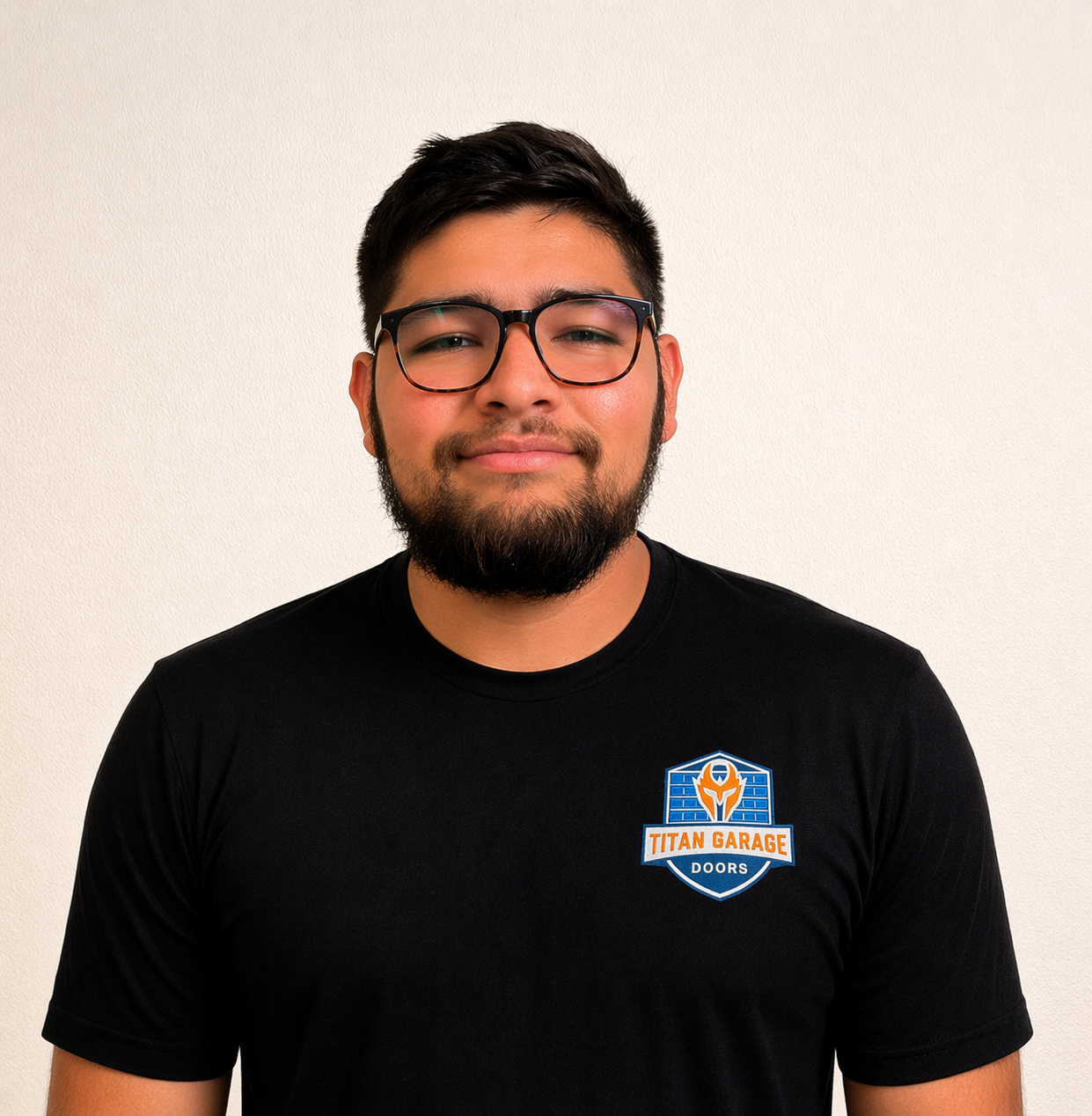 A close-up image of Aidan B., garage door technician at Titan Garage Doors CO